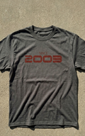 Gray t-shirt with 'Since 2003' text on a beige background