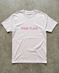 White t-shirt with 'PINK FLAG' text on a concrete surface